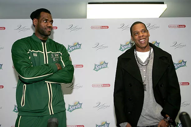 Superstar LeBron James and producer/rapper Shawn "Jay-Z" Carter speak to reporters before meeting with kids at the Dallas Boys & Girls Club on...